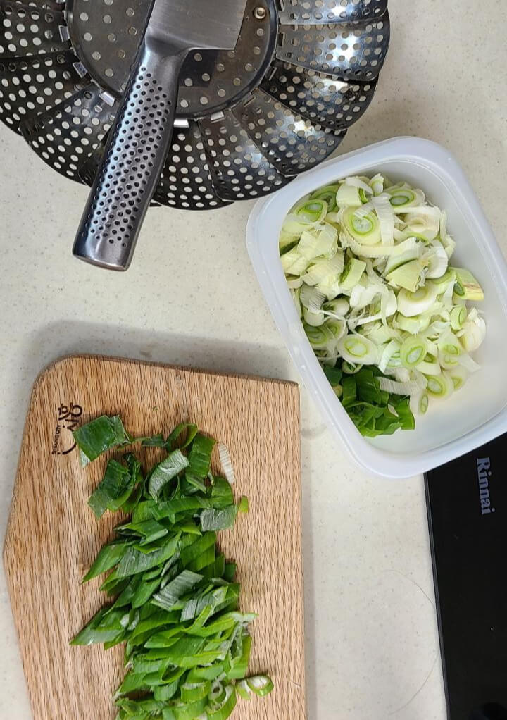 Pictures of green onions being cleaned and before frozen.